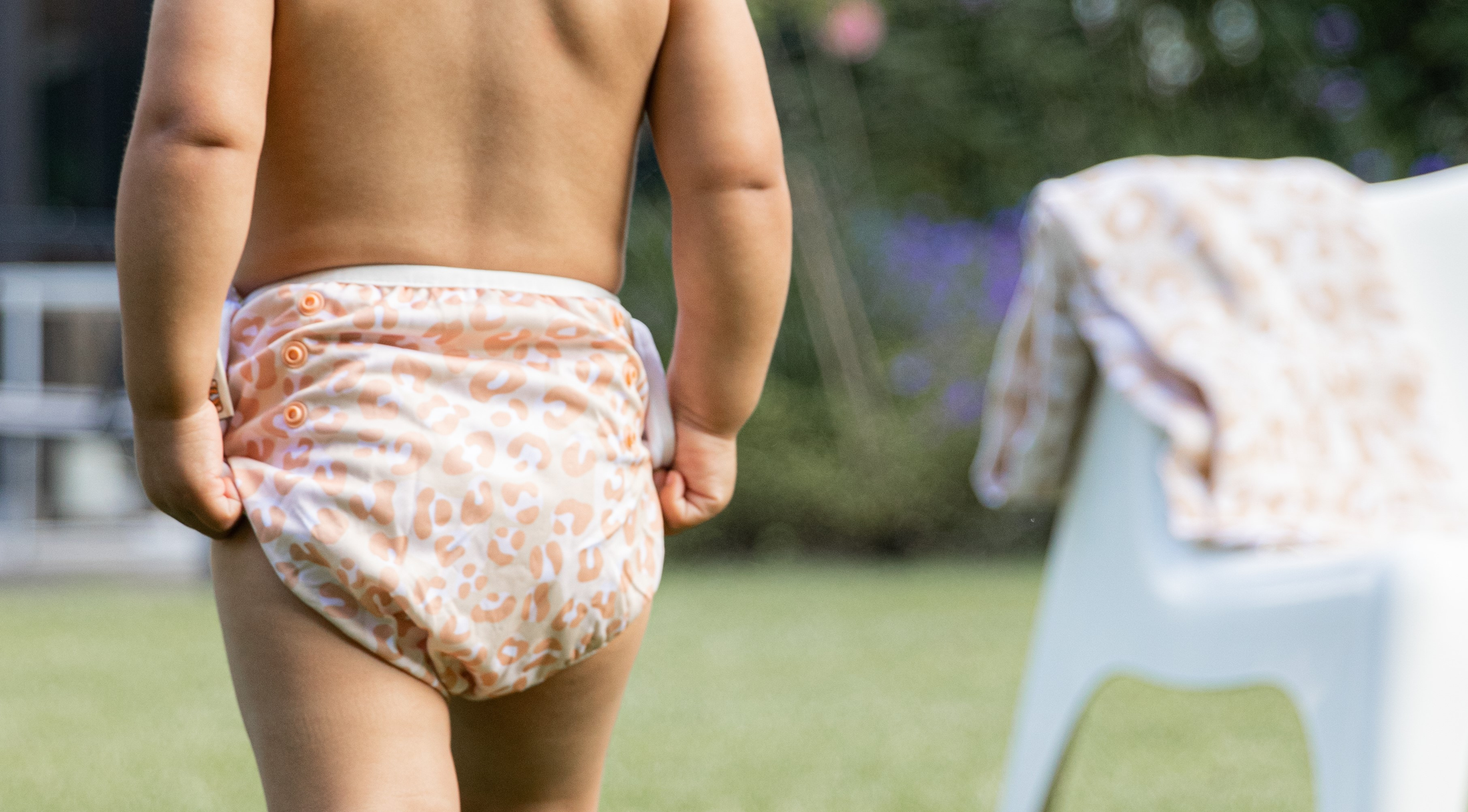 Happy Bear | Schwimmwindel Baby- Bademode mit Tiger-Motiv "Roar". Farbe: rosa/hellbraun